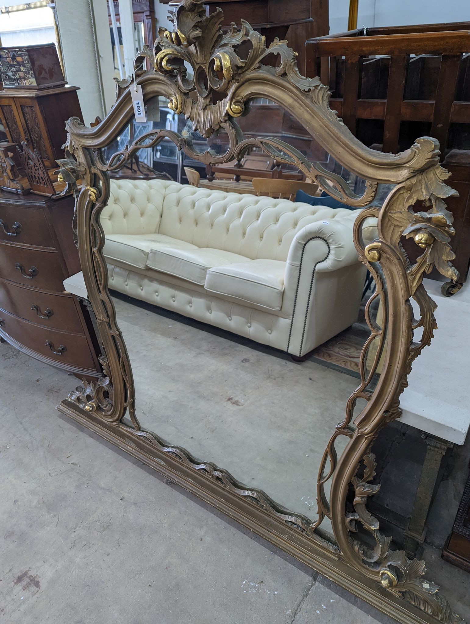 A Victorian style carved giltwood overmantel mirror, width 140cm, height 125cm
